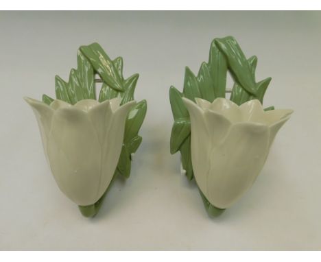 A pair or Royal Worcester wall sconce type vases in Tulip form , one in good condition with no chips, cracks or restoration ,
