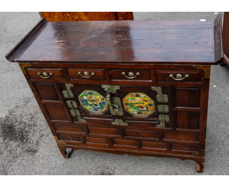A 20th Century Asian low boy / cupboard, the four upper section drawers above two cupboard doors inset with glass panels pain