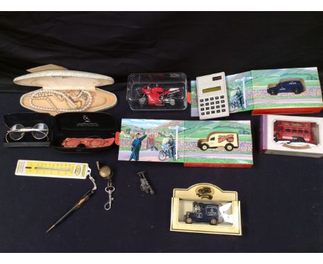 Collectors lot containing toy cars, cased specs, Casio calculator, pen/whistle, Duckhams barometer and cased pearls.