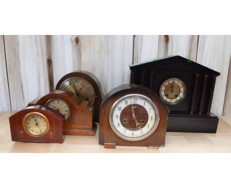 A late 19th Century French black slate mantle clock along with early to mid 20th Century mantle clocks.