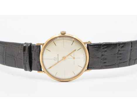 Rodania- a gentleman's vintage 9ct gold wristwatch, comprising a round champagne signed split dial, applied baton markers, su
