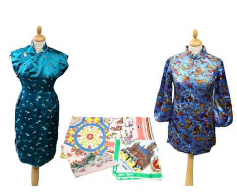  A 1970s Chinese mini dress in a blue sateen man-made fabric decorated with colourful dragons, with a metal zip and high neck