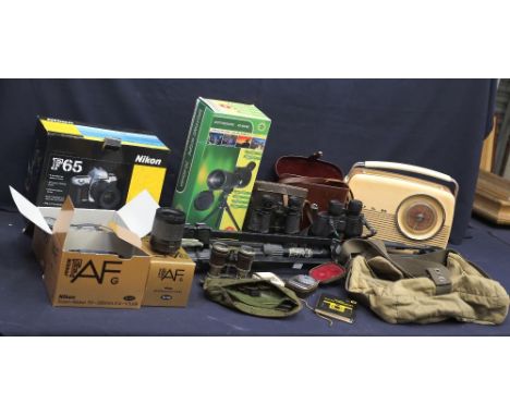 A collection of vintage camera accessories, binoculars, tripod and more.