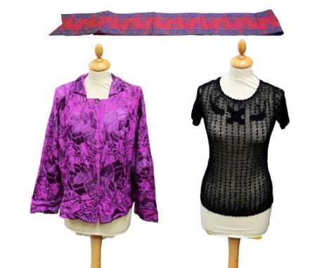  An early 1950s blouse in cerise fabric with an embossed pattern, decorative buttons, padded shoulders and a small collar. To