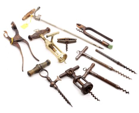 A collection of vintage corkscrews, champagne taps and bottle openers.