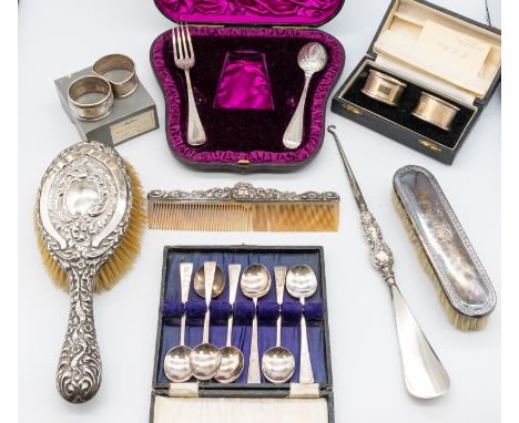 A collection of silver to include; seven matched George V modernist style silver spoons, each engraved W.P.G.C to terminals, 
