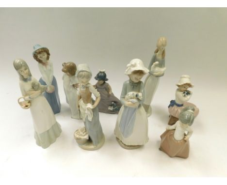 Nine Nao figures , to include 4 females with dogs 1 female figure with a Swan with 4 other figures , factory marks to bases, 