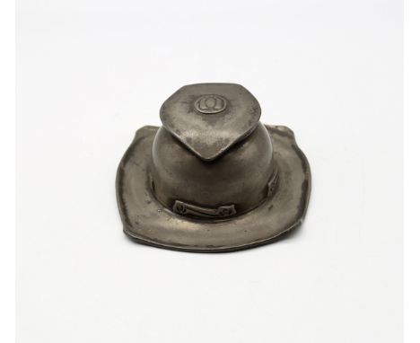 Archibald Knox for Liberty & Co - a Tudric pewter inkwell, of domed form on square base, with stylised relief design to sides