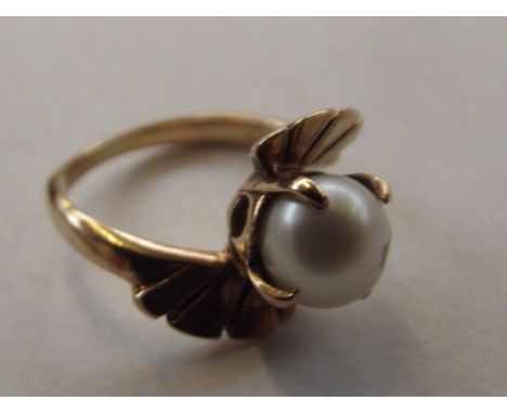 Yellow metal tested for high carat gold ring with pearl setting, size G