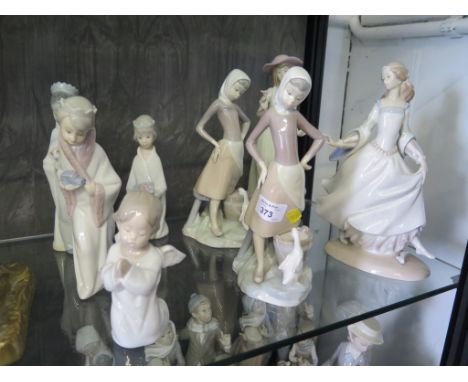Eight Lladro figures, including three of children playing the Three Kings, and other girls
