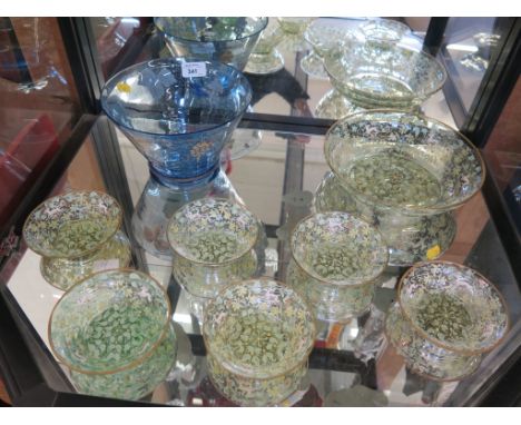 A Venetion glass and enamel set of six small and one large dishes, the green tinted glass depicting deer in foliate scrolls 2