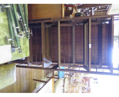 A stained wood two sectioned shoe rack, each section with two racks and a shelf, 153cm total height, 60cm wide