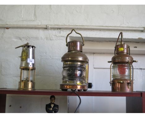Two copper ships navigation lamps, 30cm high and a Davy's miners lamp (3)
