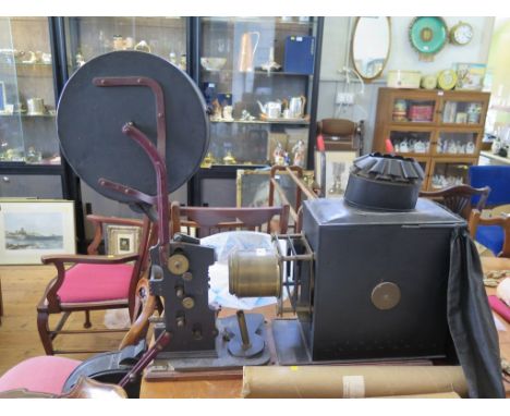 An early 20th century blacked tin magic lantern with 35mm film projector, c.1910 72cm long, 23cm wide