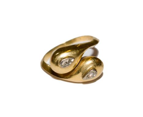 A diamond set double headed snake ring set in 18 carat gold