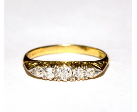 A five stone diamond ring set in 18 carat gold