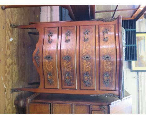 A French inlaid serpentine commode with four long drawers and sabots 59cm wide