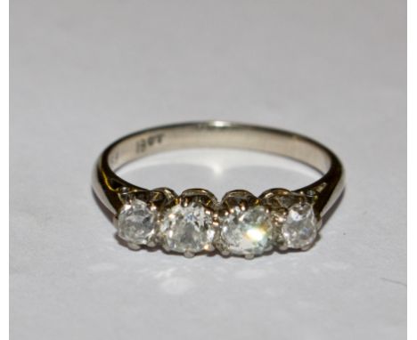 A four stone diamond ring set in 18 carat gold