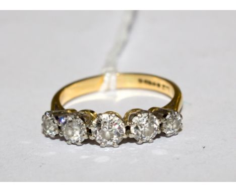 A fine quality five stone diamond ring with a spread weight of approx 1 carat 10 points set in 19 carat gold