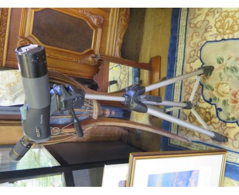 An Acuter 16x to 48x telescope on a tripod stand