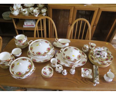 A Royal Albert Old Country Roses pattern dinner and tea service and accessories including teapot and three tier cake stand