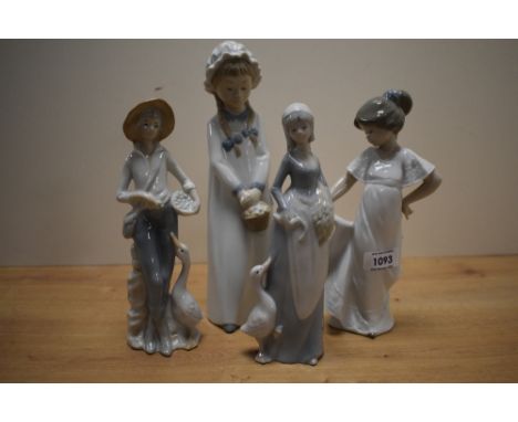 Two Nao by Lladro figurines 'Feeding The Goat' number 4590 and 'How Pretty' number 1110 sold alongside two similar figurines 