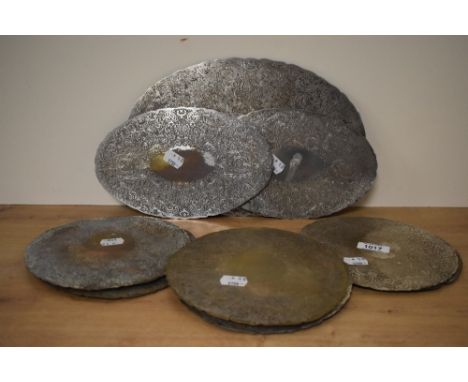 A selection of vintage silver plated placemats including ten round, two medium and one large oval placemats