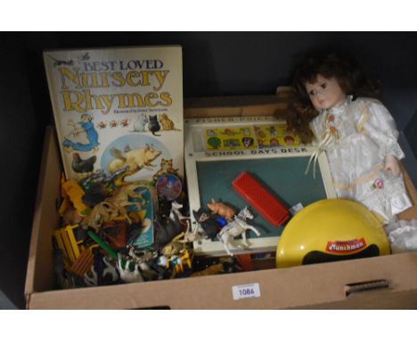 A small selection of vintage toys including a Fisher Price School Days Desk, a porcelain headed doll, a small quantity of far
