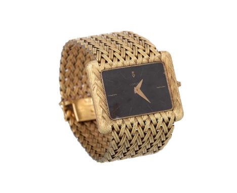 CORUM, EIGHTEEN CARAT GOLD QUARTZ WRIST WATCH, the rectangular dial with baton hour markers, 40mm case with the Farquharson c