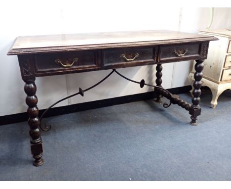 A STAINED BEECH CENTRE TABLE, IN THE SPANISH STYLE 19th century, with frieze drawers to one side, on bobbin turned legs joine