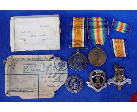 A FIRT WORLD WAR PAIR: 'G 53198 PTE. G. IBELL. MIDD'X R.' with a Middlesex Regiment cap badge, another badge 'FIDE ET FIDUCIA