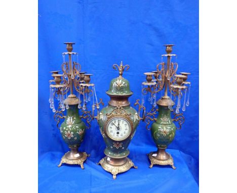 AN EARLY 19th CENTURY CLOCK AND CANDELABRA GARNITURE gilded metal with glass pendants and raised enamel floral decoration in 