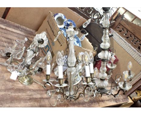 A BRASS AND CUT-GLASS CHANDELIER 20th century, with a glass stem, 75cm high x 50cm wide, together with two similar smaller ex