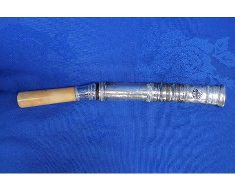 AN EASTERN SHORT DAGGER OR KRIS, WITH WHITE METAL SCABBARD and ivory handle