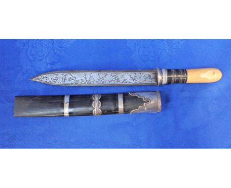 AN INDIAN DAGGER, WITH PROFUSELY ENGRAVED BLADE in white metal mounted bamboo sheath 33.5cm long overall