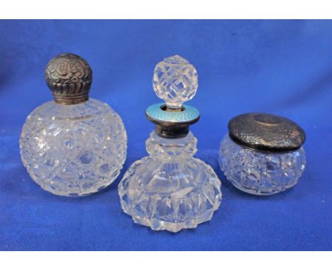 A CUT-GLASS SCENT BOTTLE WITH GUILLOCHE ENAMEL COLLAR and two other silver topped items