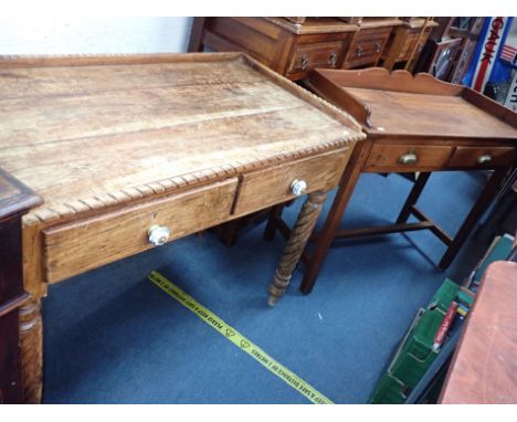 AN INDIAN SIDE TABLE, ON SPIRAL-TURNED LEGS with a three-quarter galleried top, with ceramic drawer handles, 80cm high x 103c