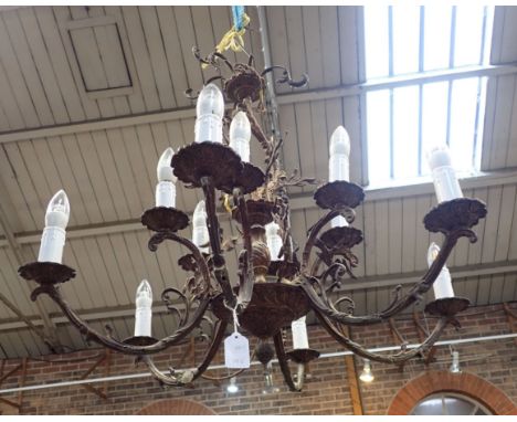 A PAIR OF GILT-METAL TWELVE-LIGHT CHANDELIERS 20th century, with cast scrolling rococo decoration, 72cm high x 82cm wide (2)