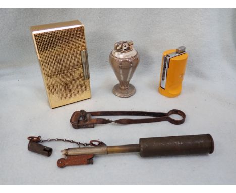 A STEEL TINDER LIGHTER, ANOTHER PRIMITIVE LIGHTER and vintage table lighters by Ronson and Zenith