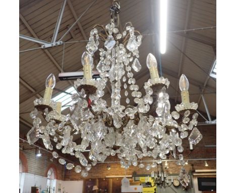 A GILT METAL AND CUT-GLASS CHANDELIER 20th century, the central column with a glass stem, 68cm high x 63cm wide
