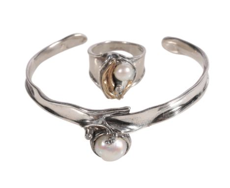 A HAND CRAFTED SILVER PEARL AND DIAMOND TORQUE BANGLE together with an en-suite ring, ring size N-O