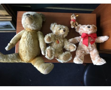 Three Steiff teddy bears with buttons in ears, to include one growler, together with another growler teddy bear.