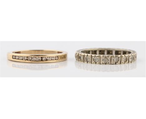A diamond half eternity ring, bar set with eleven diamond accents, stamped 9kt, ring size O1/2, together with a paste full et