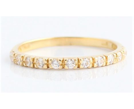A cubic zirconia half eternity ring, stamped 750, ring size M. BOOK A VIEWING TIME SLOT ON OUR WEBSITE FOR THIS LOT. IMPORTAN