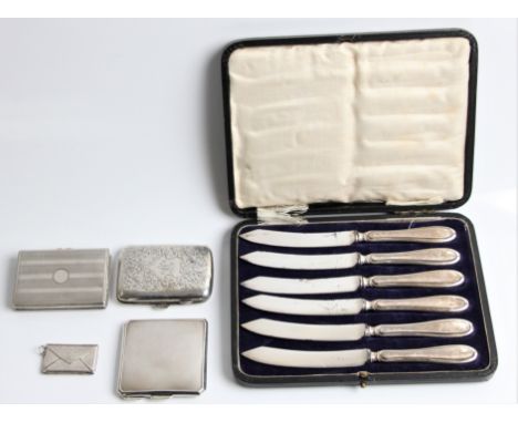 A boxed set of six hallmarked silver handled knives, together with a hallmarked silver cigarette case, a hallmarked silver co