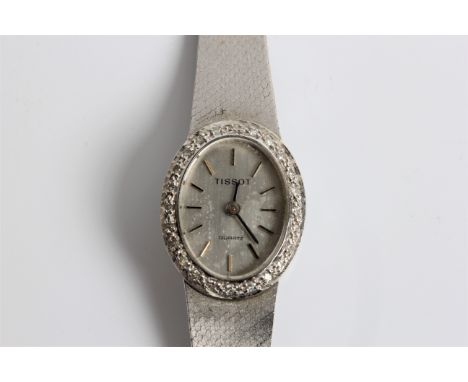 A Tissot quartz Lady's wristwatch on bracelet strap, marked 585, in box, approx. weight of watch 31.28gms. BOOK A VIEWING TIM