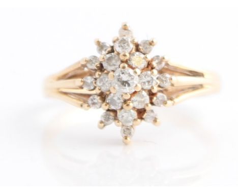 A hallmarked 9ct yellow gold diamond cluster ring, set with three tiers of round brilliant cut diamonds, total diamond weight