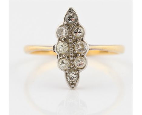 An eight stone diamond ring, the scalloped navette setting set with eight graduated round brilliant cut diamonds, total diamo