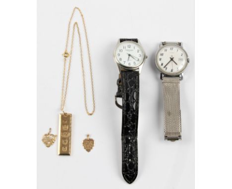 A hallmarked 9ct yellow gold ingot, on unmarked chain, together with two heart shaped pendants, one stamped 9ct, along with a