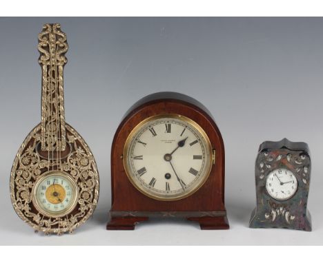 A George V mahogany mantel timepiece, the silvered circular dial with black Roman hour numerals and inscribed 'Kendal &amp; D